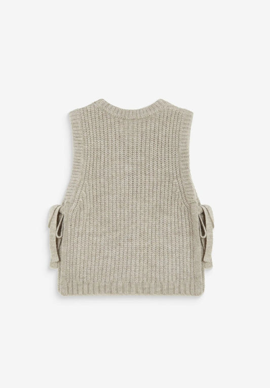 A sleeveless ribbed knit vest in a light beige or oatmeal color, shown from both front and back views on a white background. The front features the text 'GRACE & MILA' printed across the chest, and the back has side tie details.