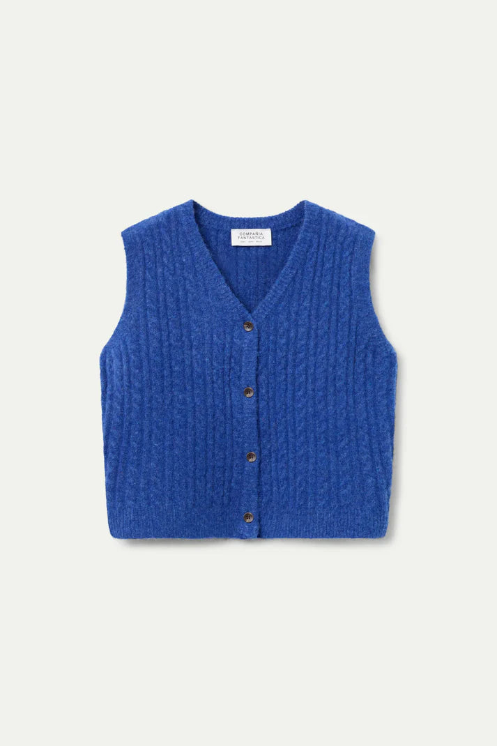 Blue knitted vest with buttons on a light gray background