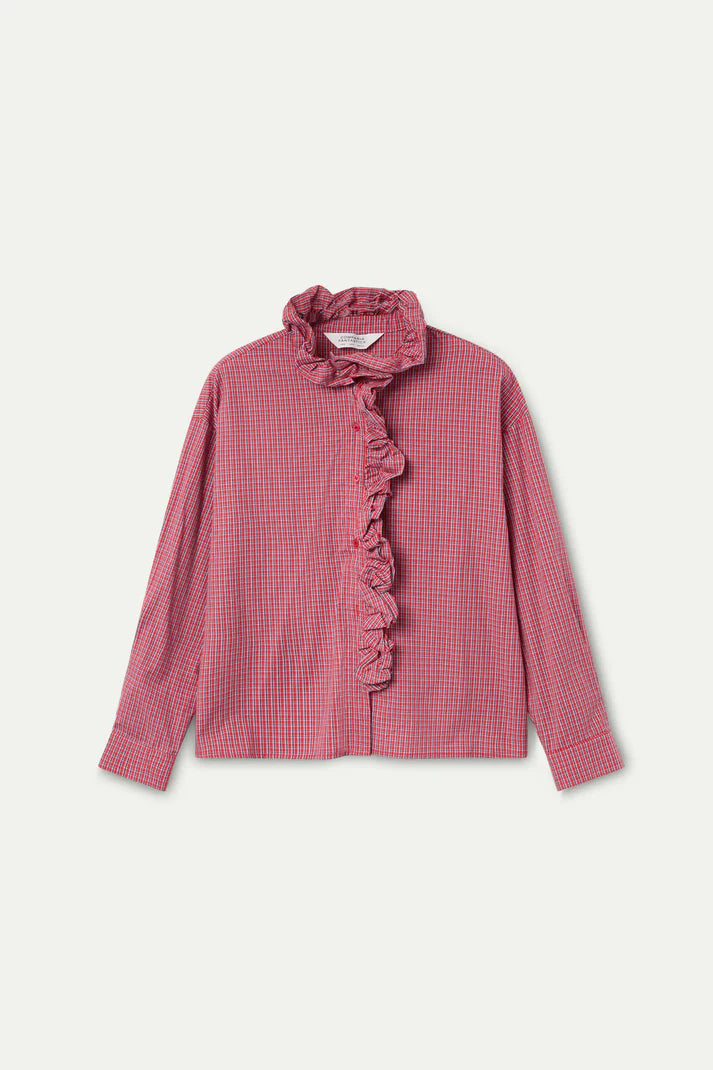 Red checkered blouse with ruffled details on a light pink background