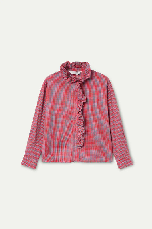 Red checkered blouse with ruffled details on a light pink background