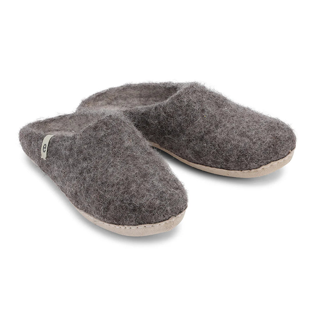 Pair of gray slippers on a white background