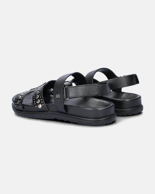 black sandal with silver studs on a white background