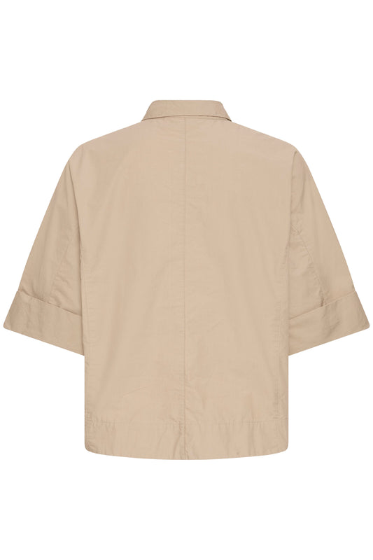 Beige shirt on a white background