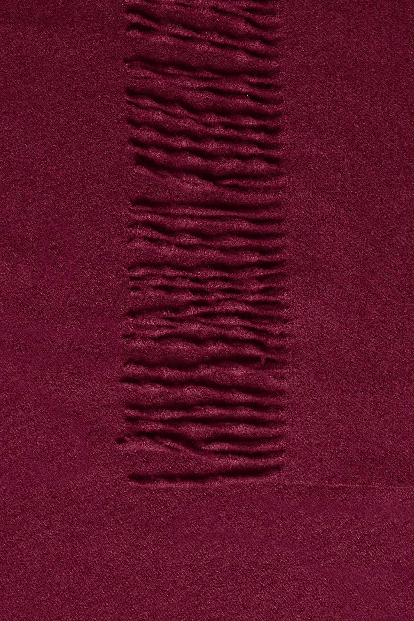 Close-up of a textured purple fabric with a horizontal stripe.