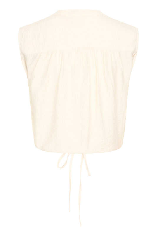 Cream-colored sleeveless top on a white background