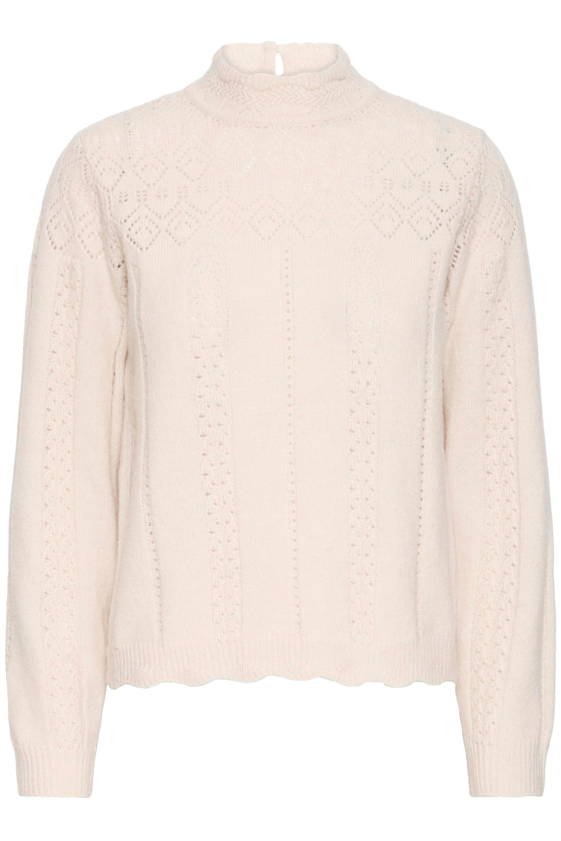 Beige cable knit sweater on a white background