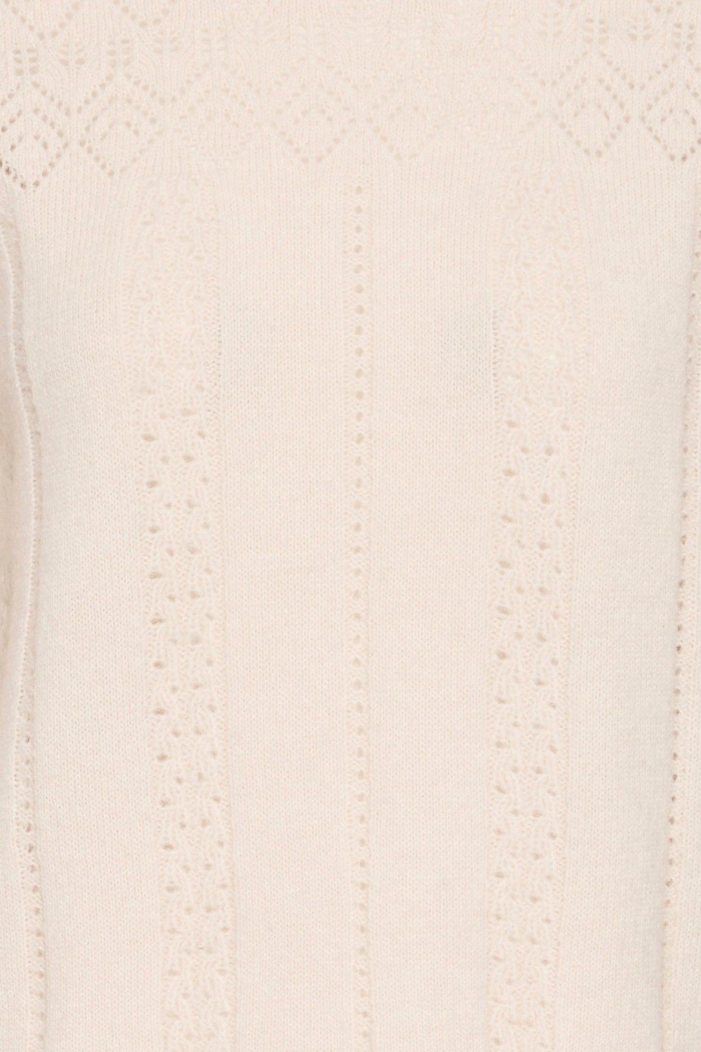 Close-up of a textured beige fabric surface