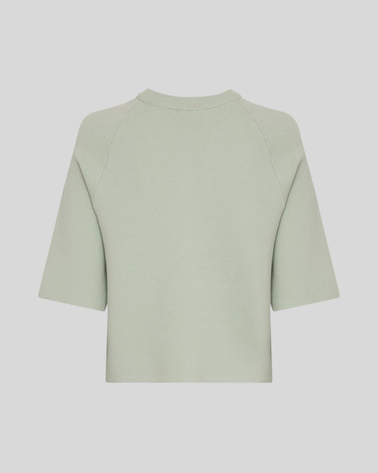 light green cardigan on light grey background