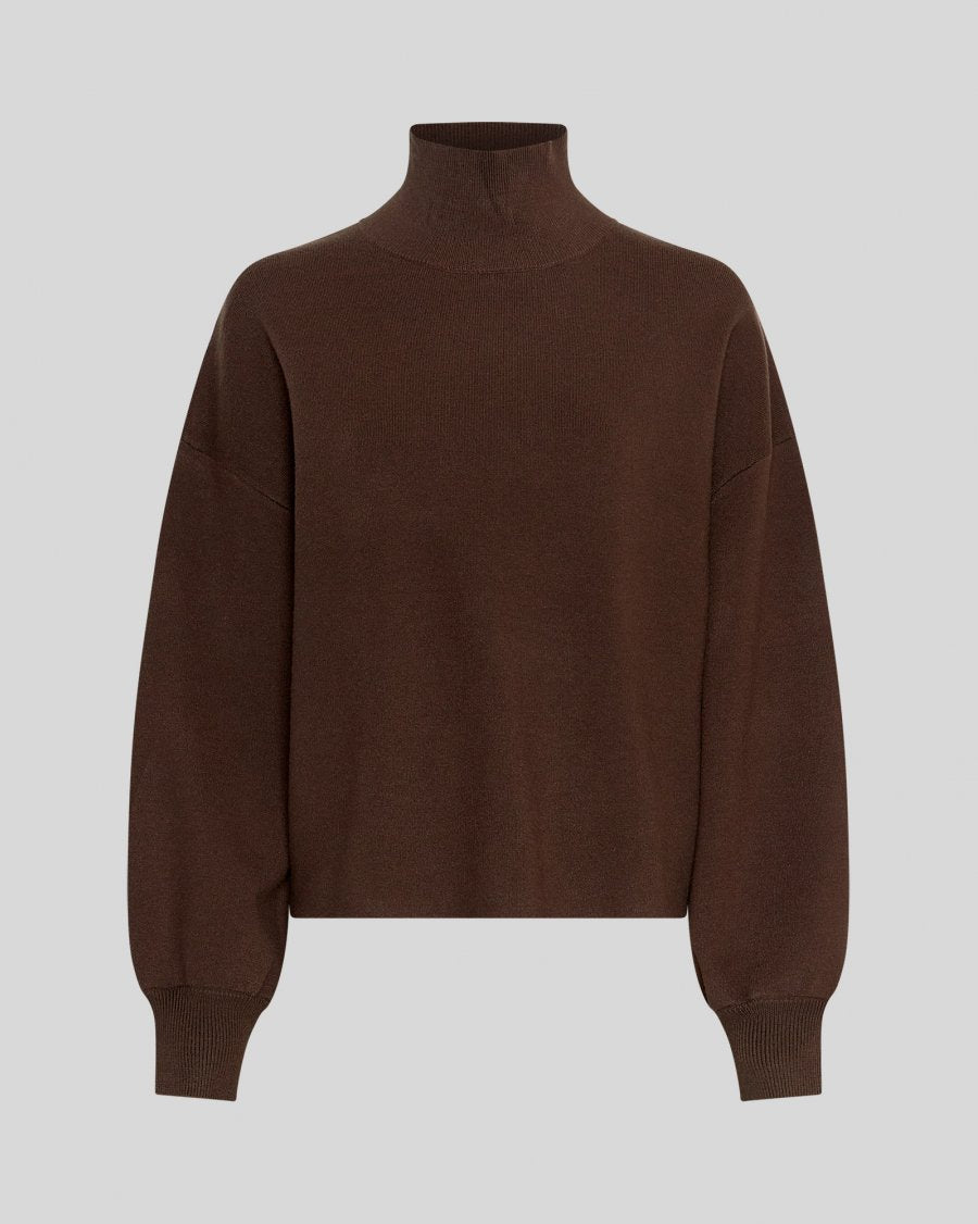 Brown turtleneck sweater on a light gray background