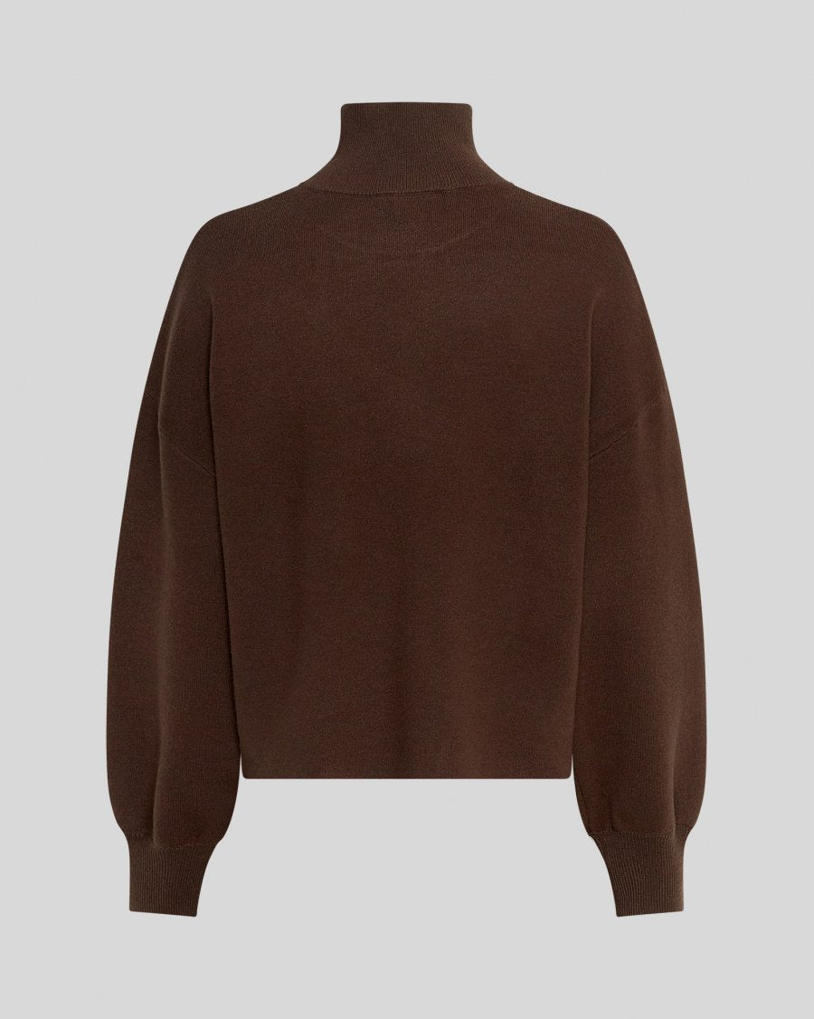Brown turtleneck sweater on a light gray background