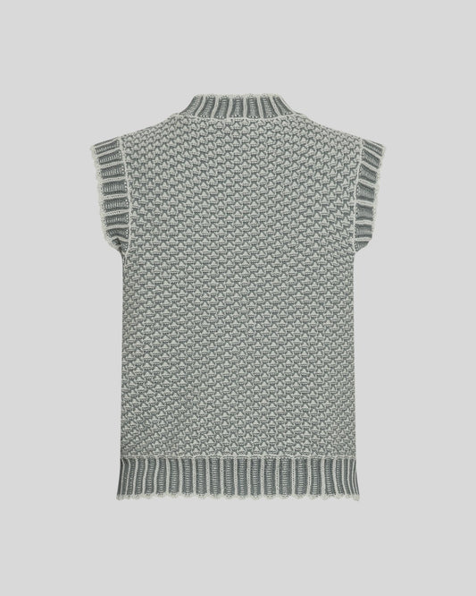 Green knitted vest on a light grey background