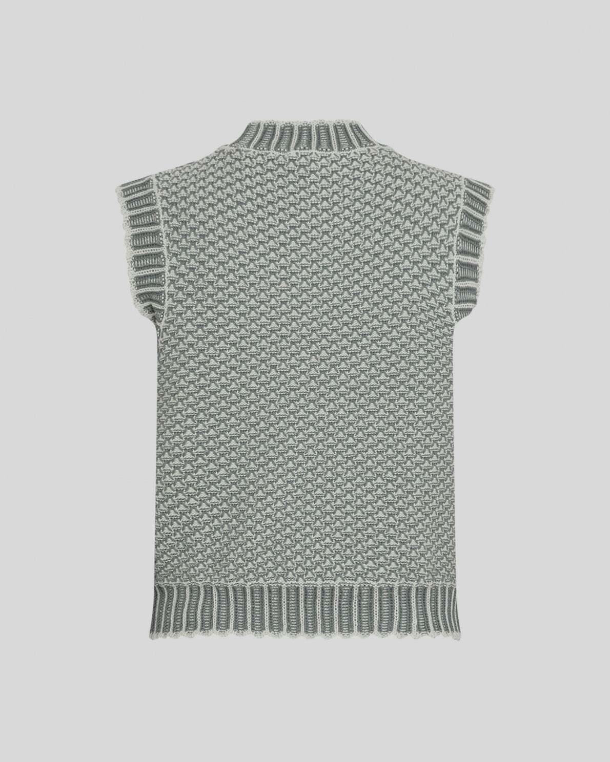 Green knitted vest on a light grey background