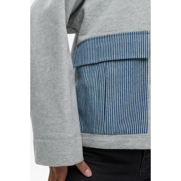 Grey sweatshirt with a blue striped pocket on a white background