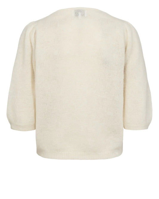 Cream-colored sweater on a white background