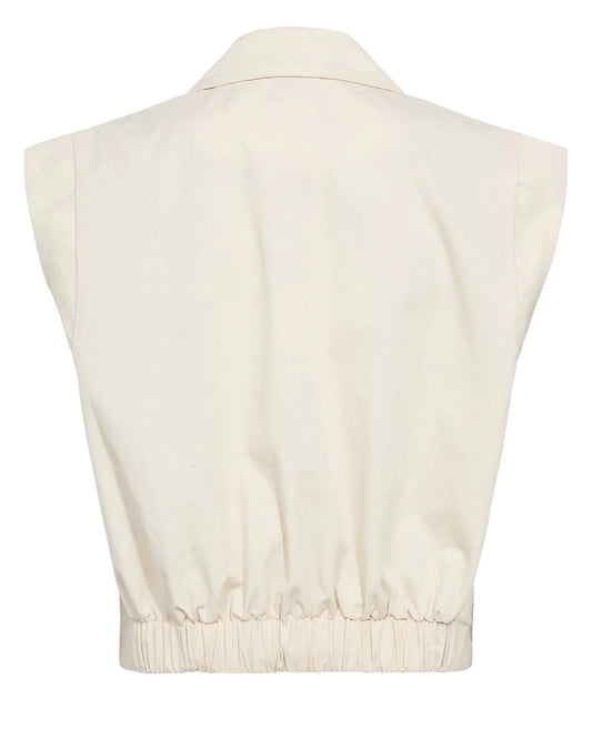 Beige sleeveless top on a mannequin with a white background