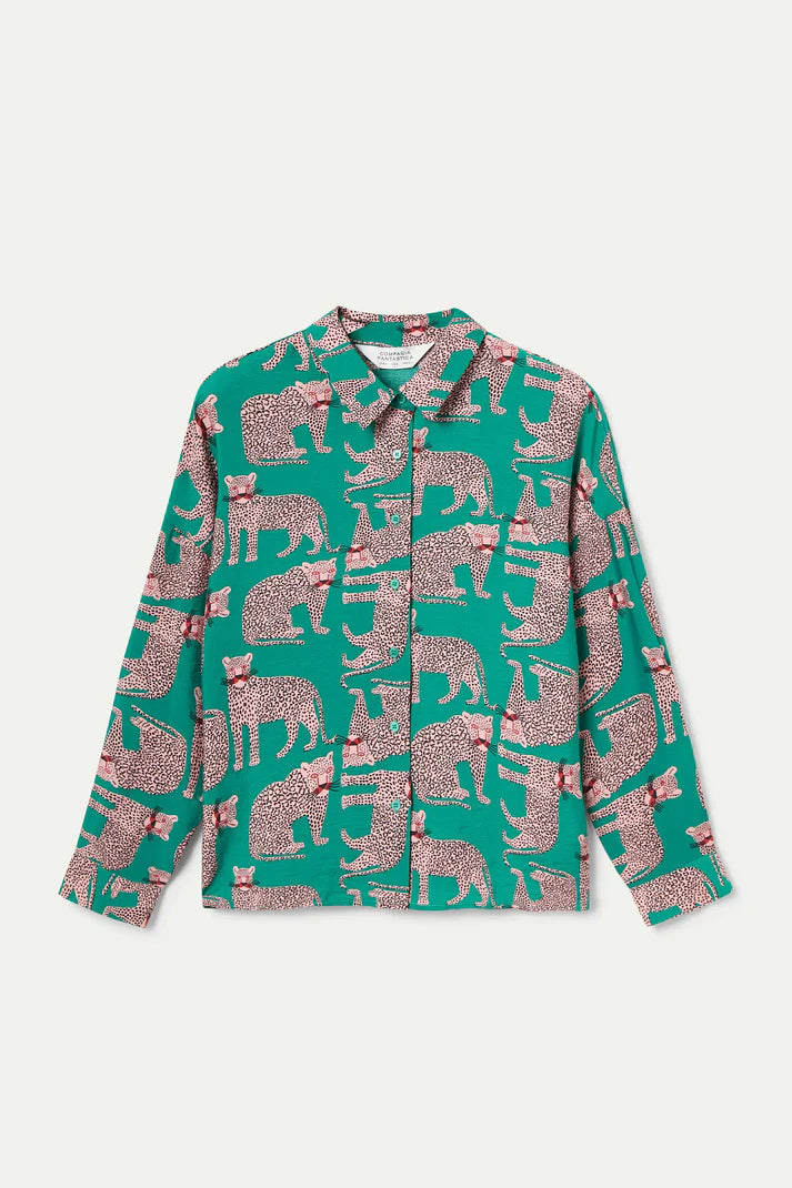 Green shirt with pink animal pattern on a white background