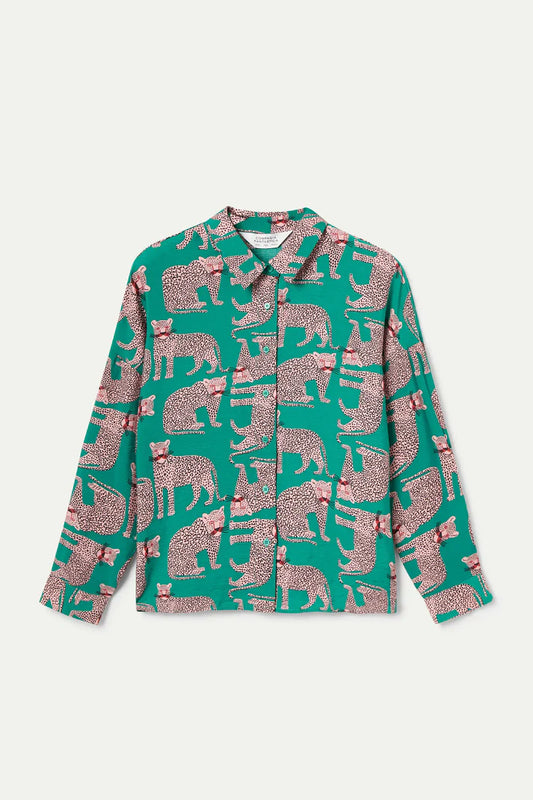 Green shirt with pink animal pattern on a white background