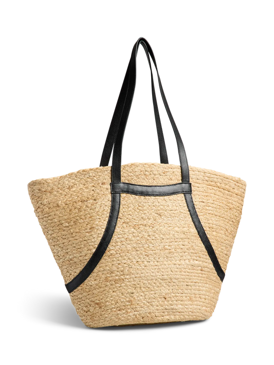 Woven straw tote bag with black straps on a white background