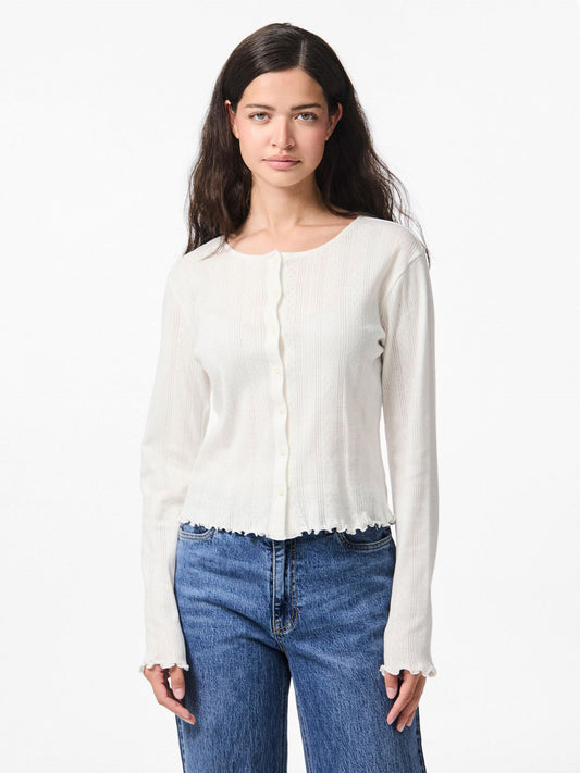 Woman wearing a white blouse and blue jeans on a white background