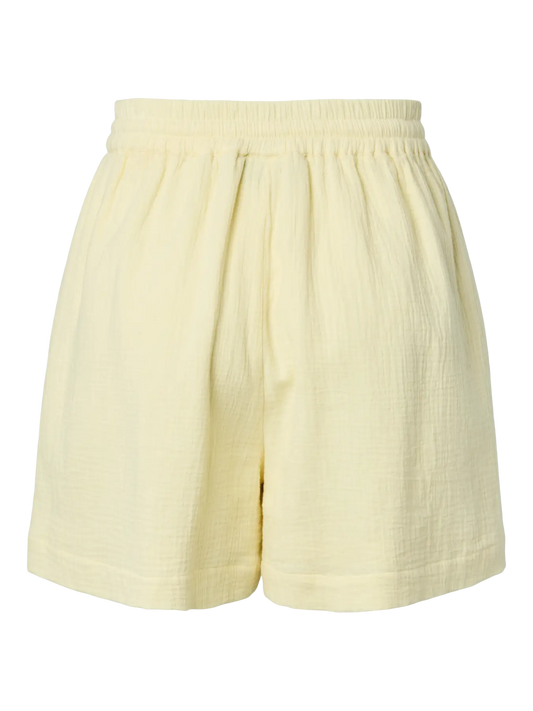 Light yellow shorts on a white background