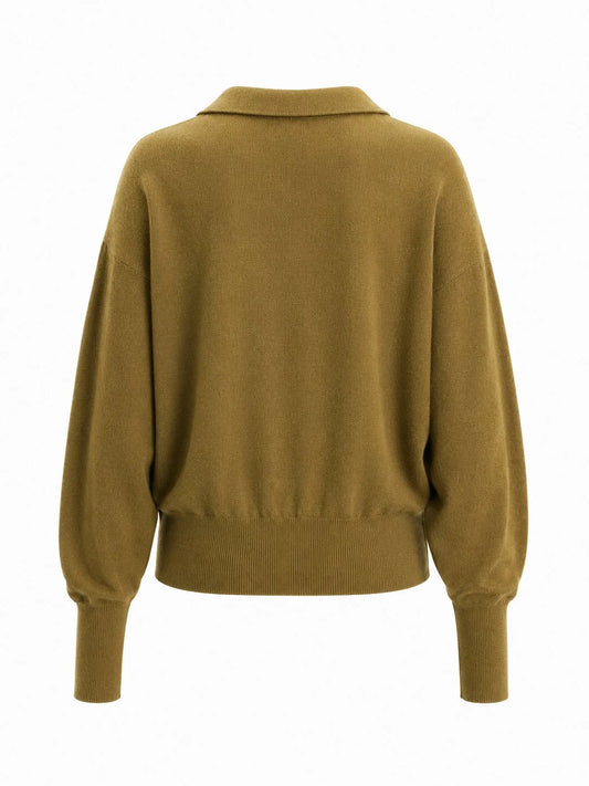 A single knit pullover sweater shown from the back on a plain white studio background. The garment has a muted mustard-olive tone with long sleeves, a wide collar, and ribbed cuffs and hem.