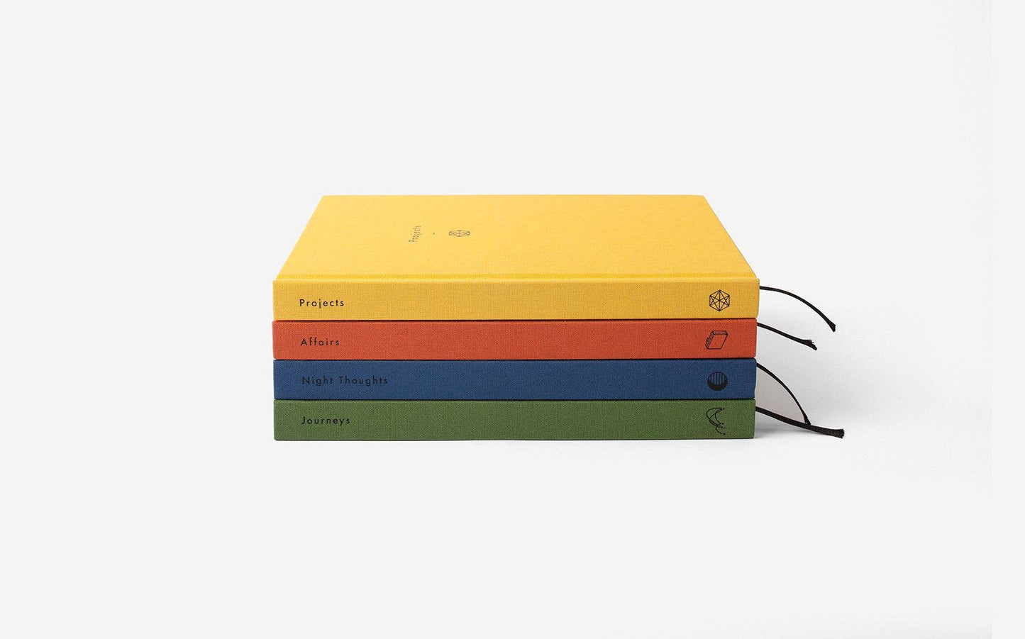 Stack of colorful notebooks on a white background