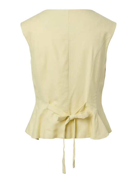 Light yellow sleeveless top with a tie detail on a white background
