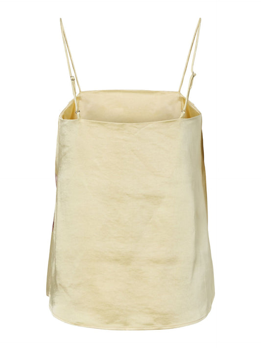 Pale yellow strappy top on a white background