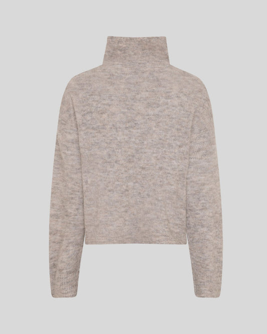 A light beige knit turtleneck sweater shown from the back, featuring a textured heathered pattern and ribbed cuffs and hem, set against a solid light gray background.