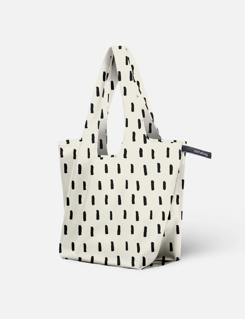 White tote bag with black abstract pattern on a white background