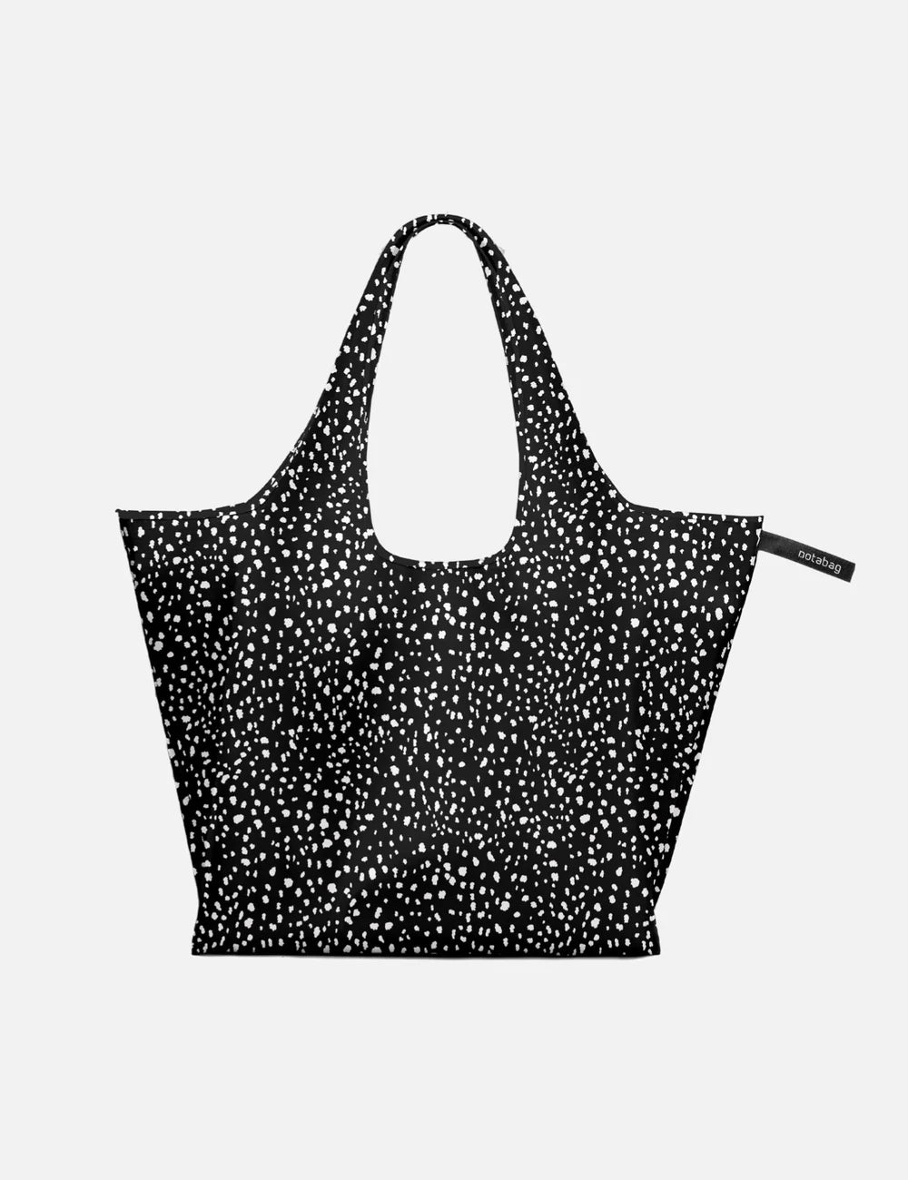 Black tote bag with white pattern on a light gray background