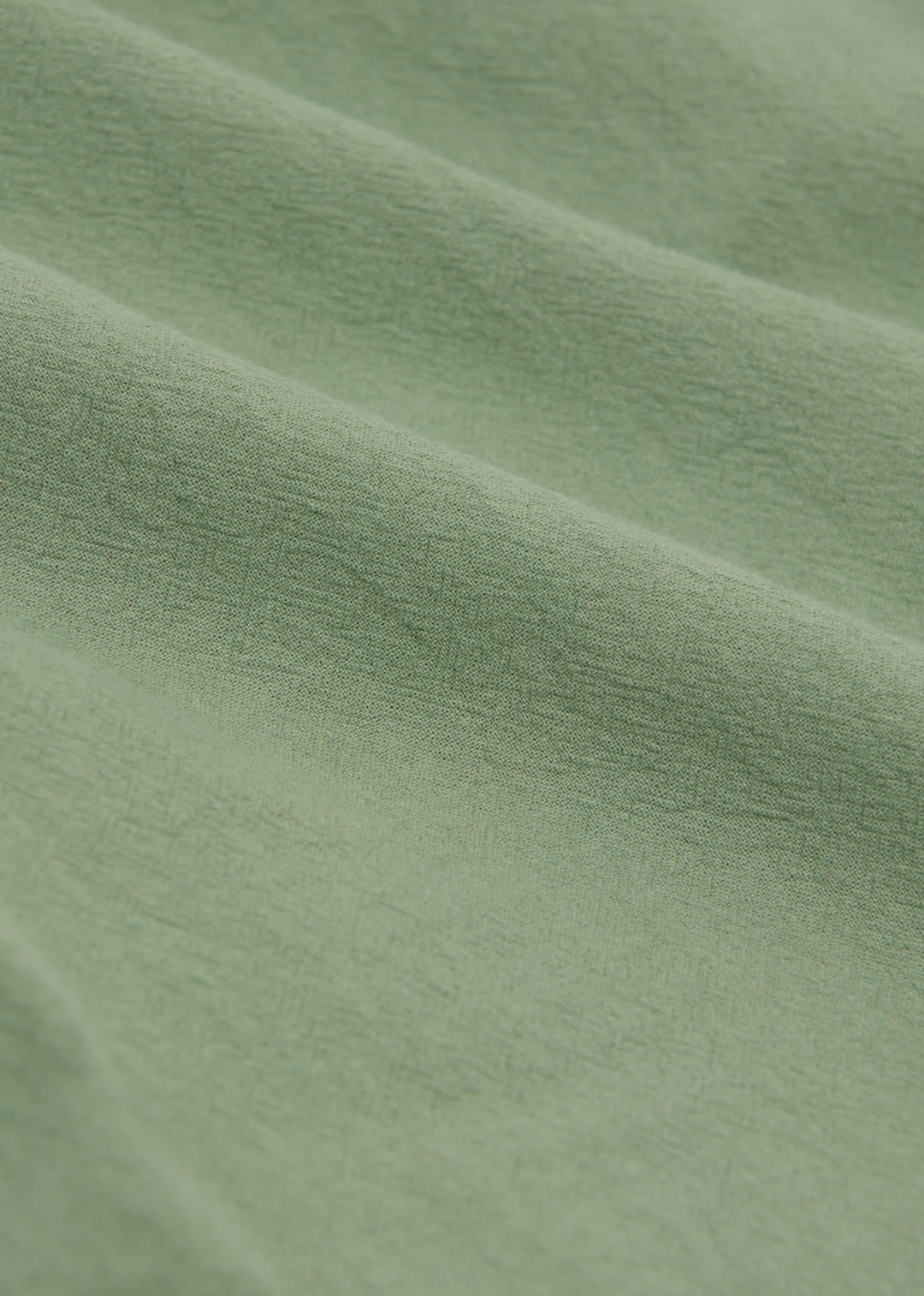Close-up of green fabric with visible texture
