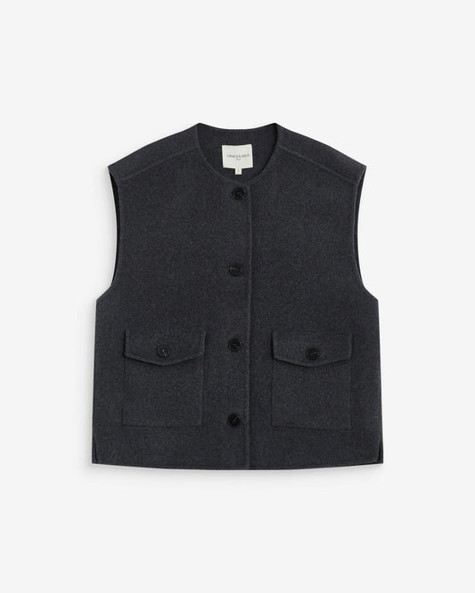 A dark charcoal gray sleeveless button-up vest with two front flap pockets, displayed flat against a light gray background.