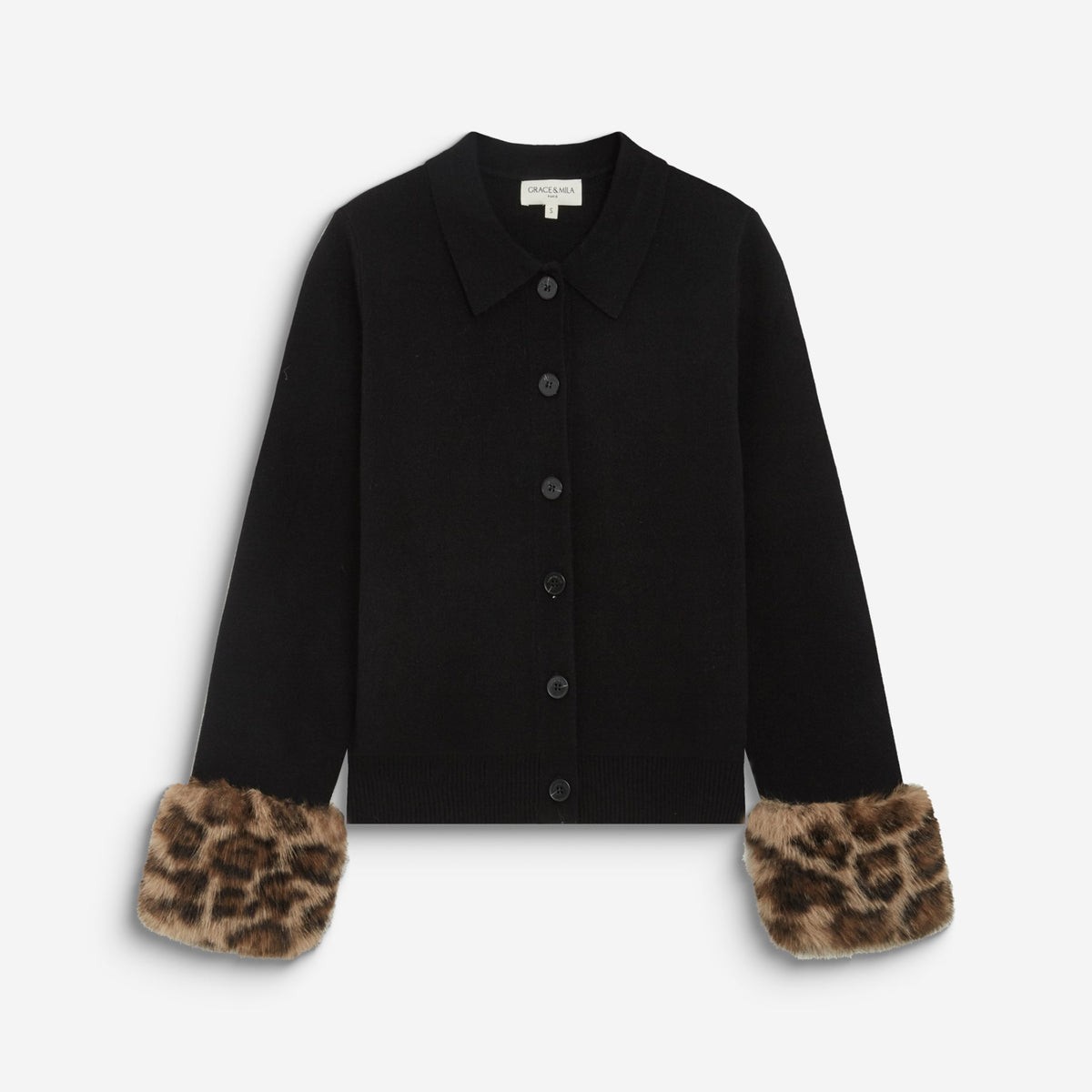 A black long-sleeve button-front cardigan with leopard-print faux fur cuffs, displayed flat against a light gray background.