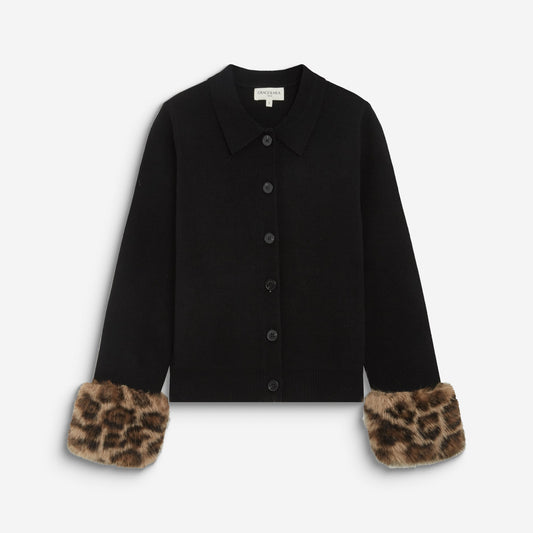 A black long-sleeve button-front cardigan with leopard-print faux fur cuffs, displayed flat against a light gray background.