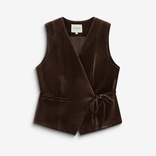 A dark brown velvet wrap vest with a tie waist and front pockets, displayed flat against a light gray background.