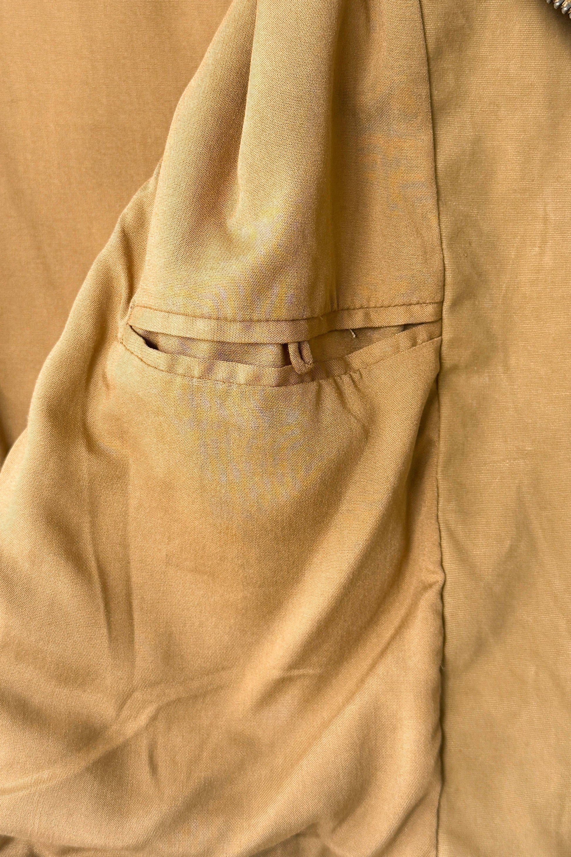 Close-up of a beige fabric with stitching details