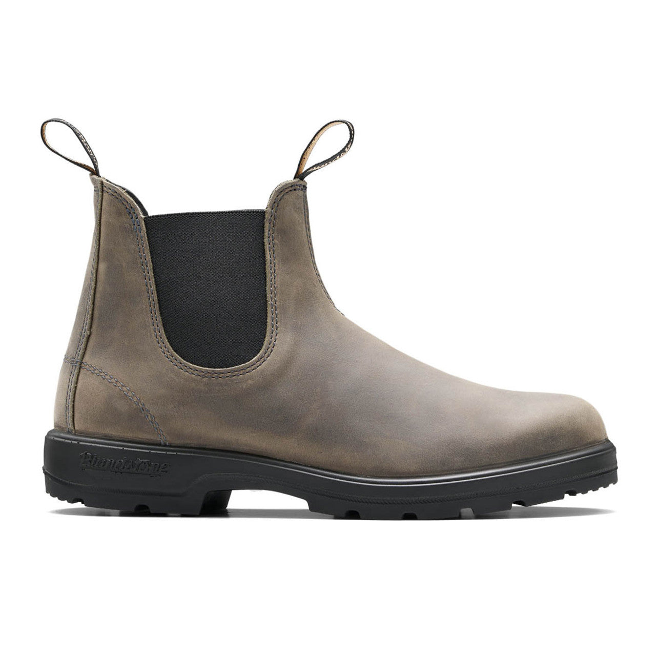 Brown Chelsea boot with black sole on a white background