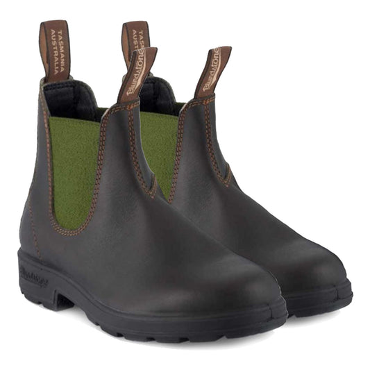 Pair of black Chelsea boots with green accents on a white background