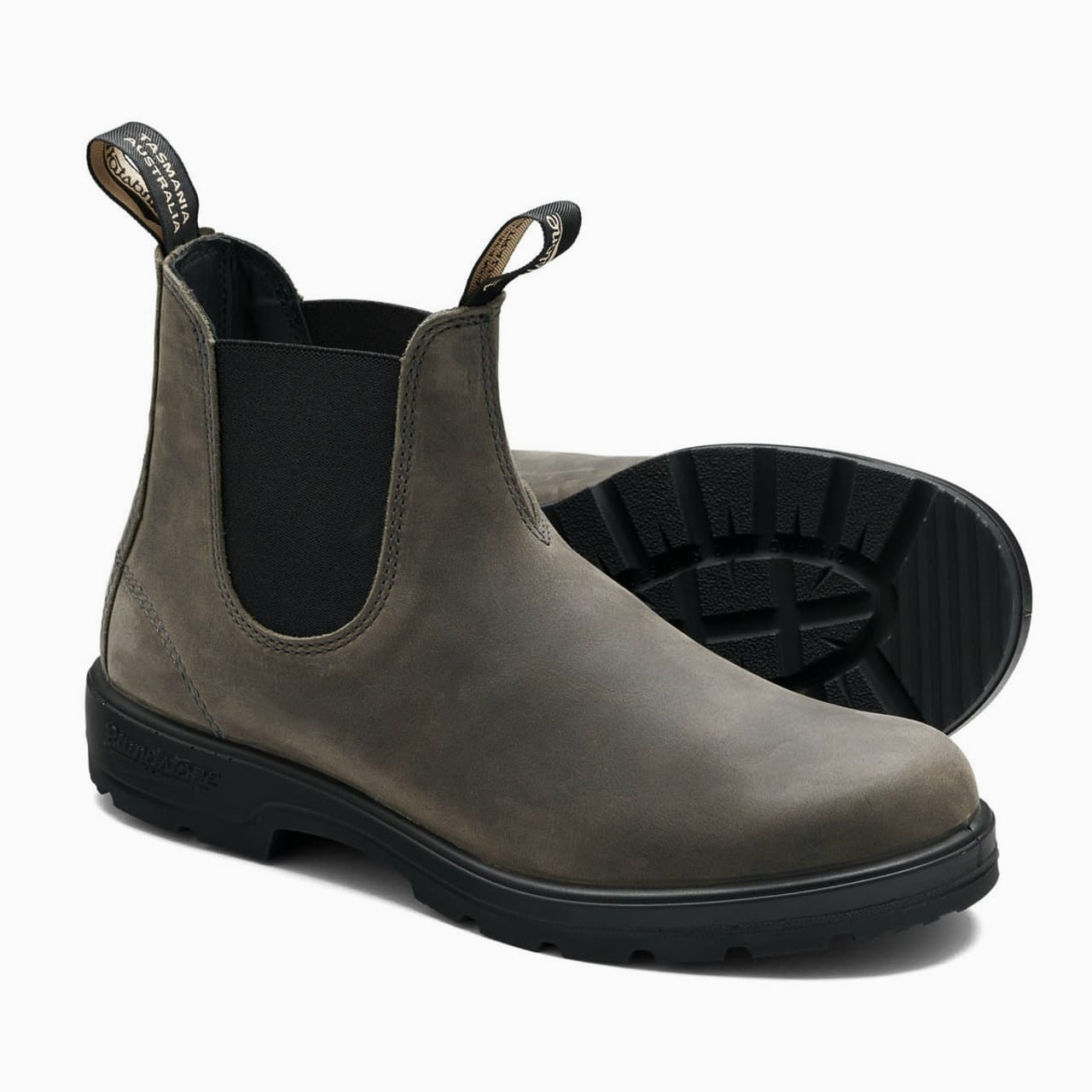Gray Chelsea boot with black sole on a white background