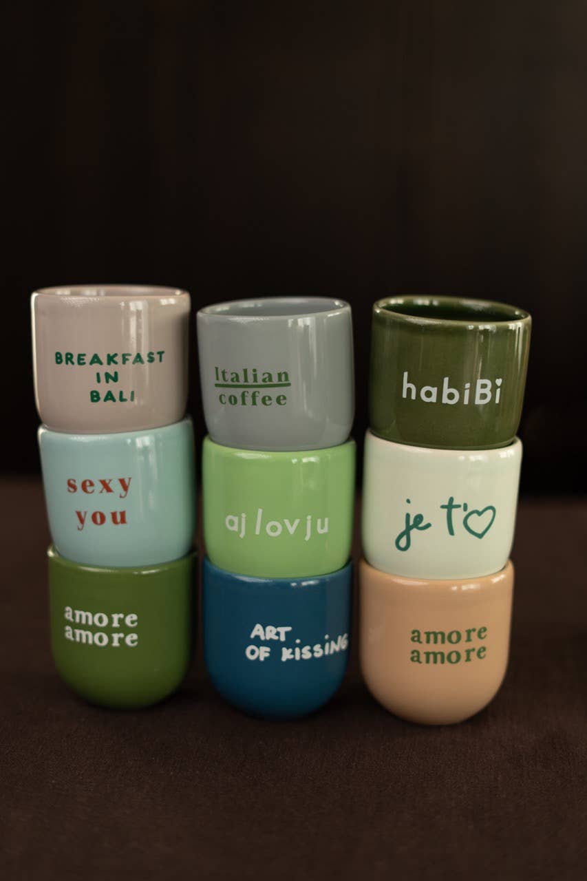 Set of ceramic containers with text on a dark background