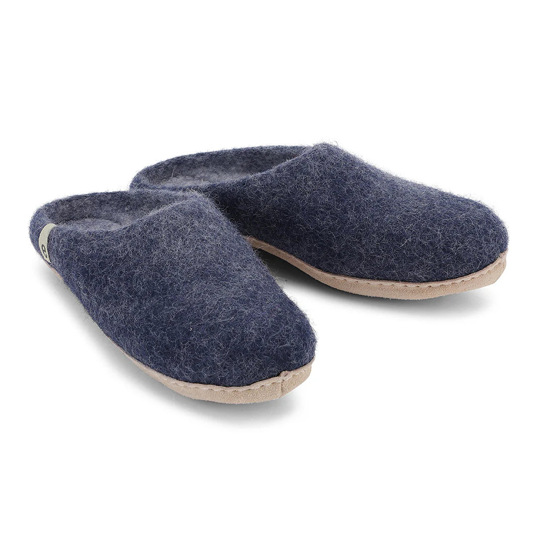 Pair of blue slippers on a white background