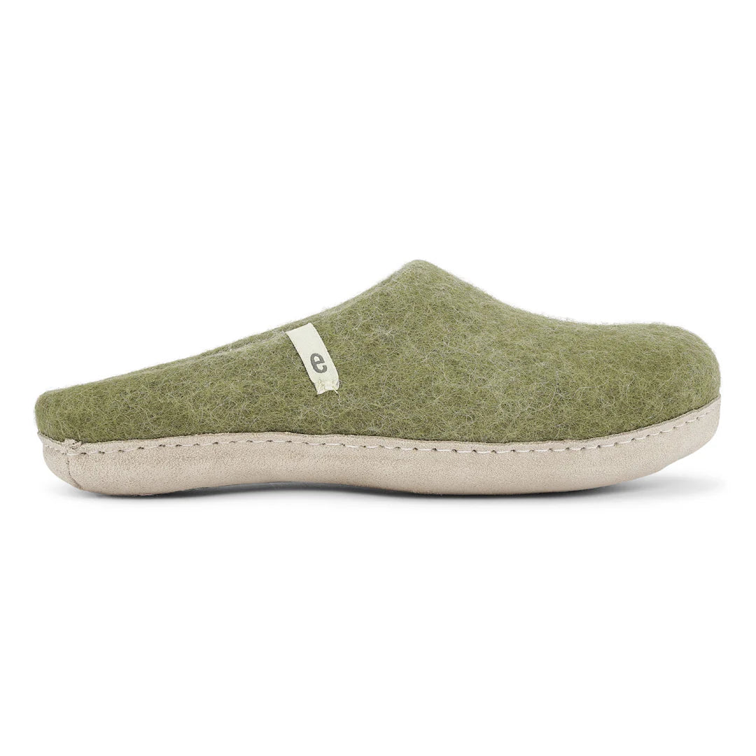 Green felt wool slipper on white background