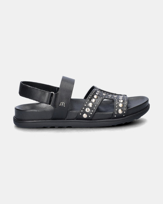 black sandal with silver studs on a white background