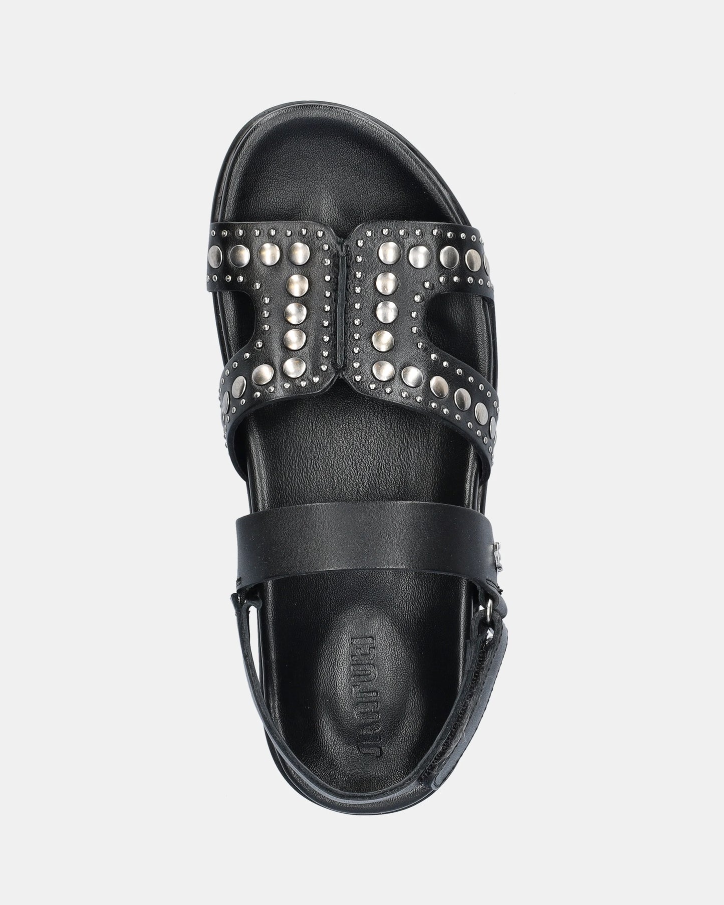 black sandal with silver studs on a white background
