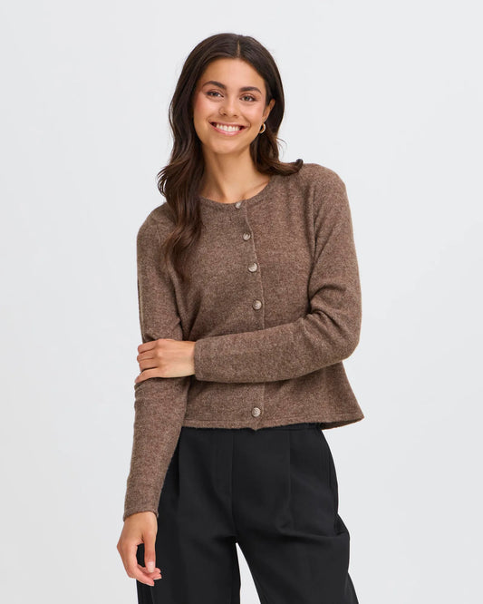 Woman wearing a brown cardigan on a white background