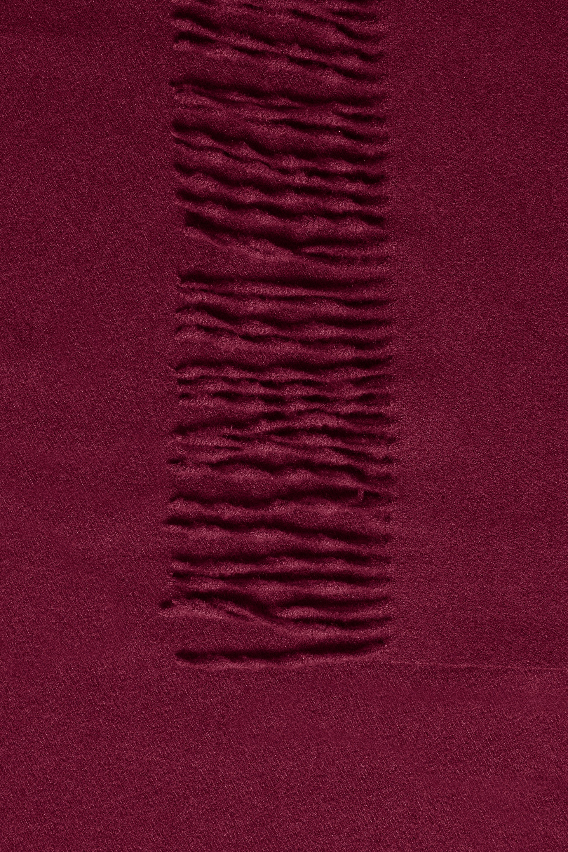 Close-up of a textured purple fabric with a horizontal stripe.