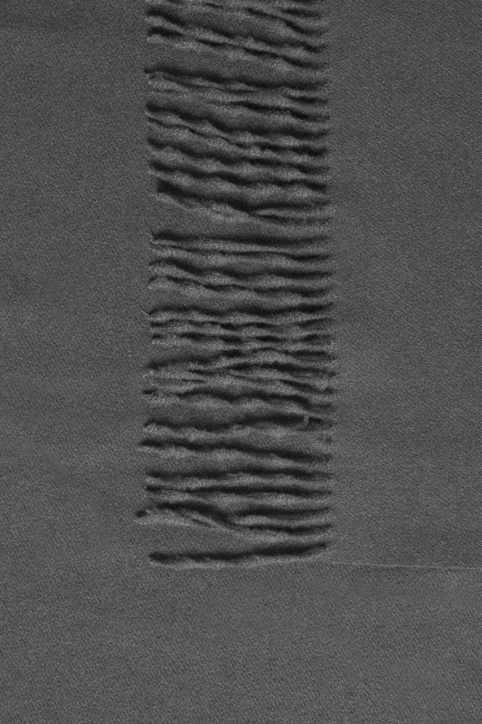 Textured dark gray surface with wavy pattern
