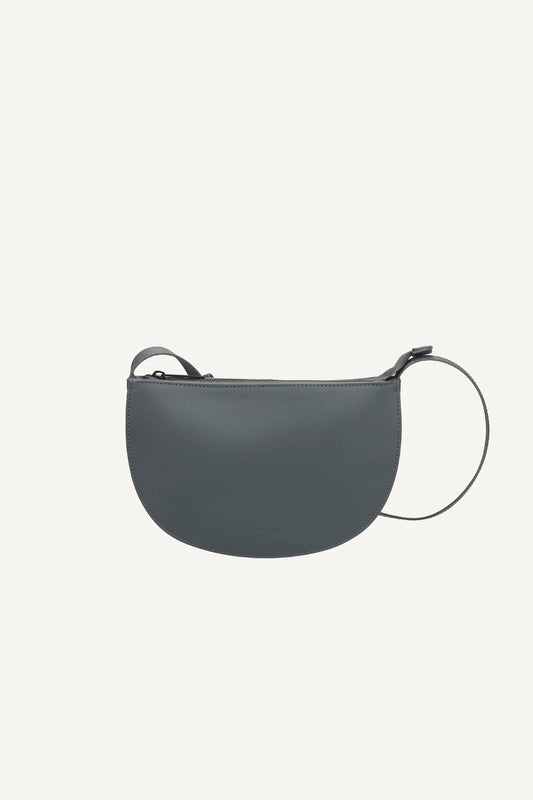 blue grey handbag on a white backgroun