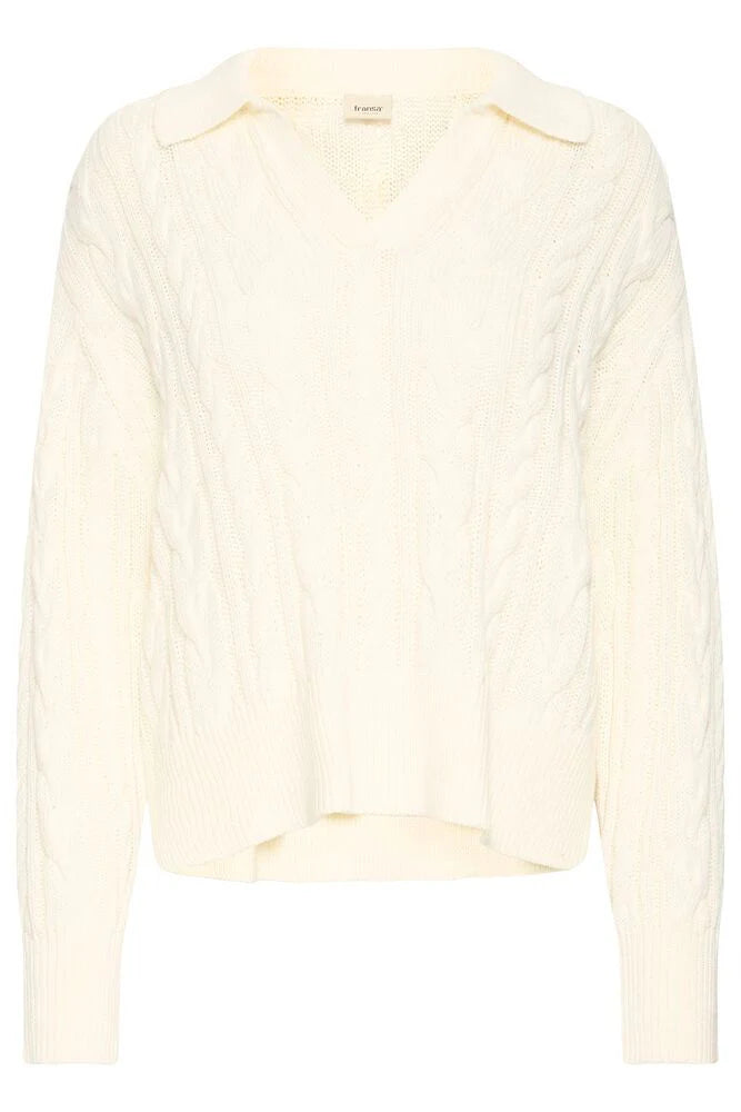 a cream cable knit pullover on a white background